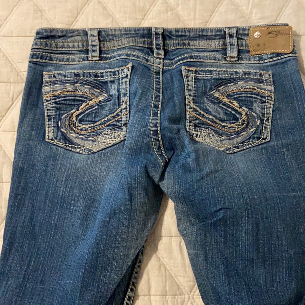 Silver jeans.